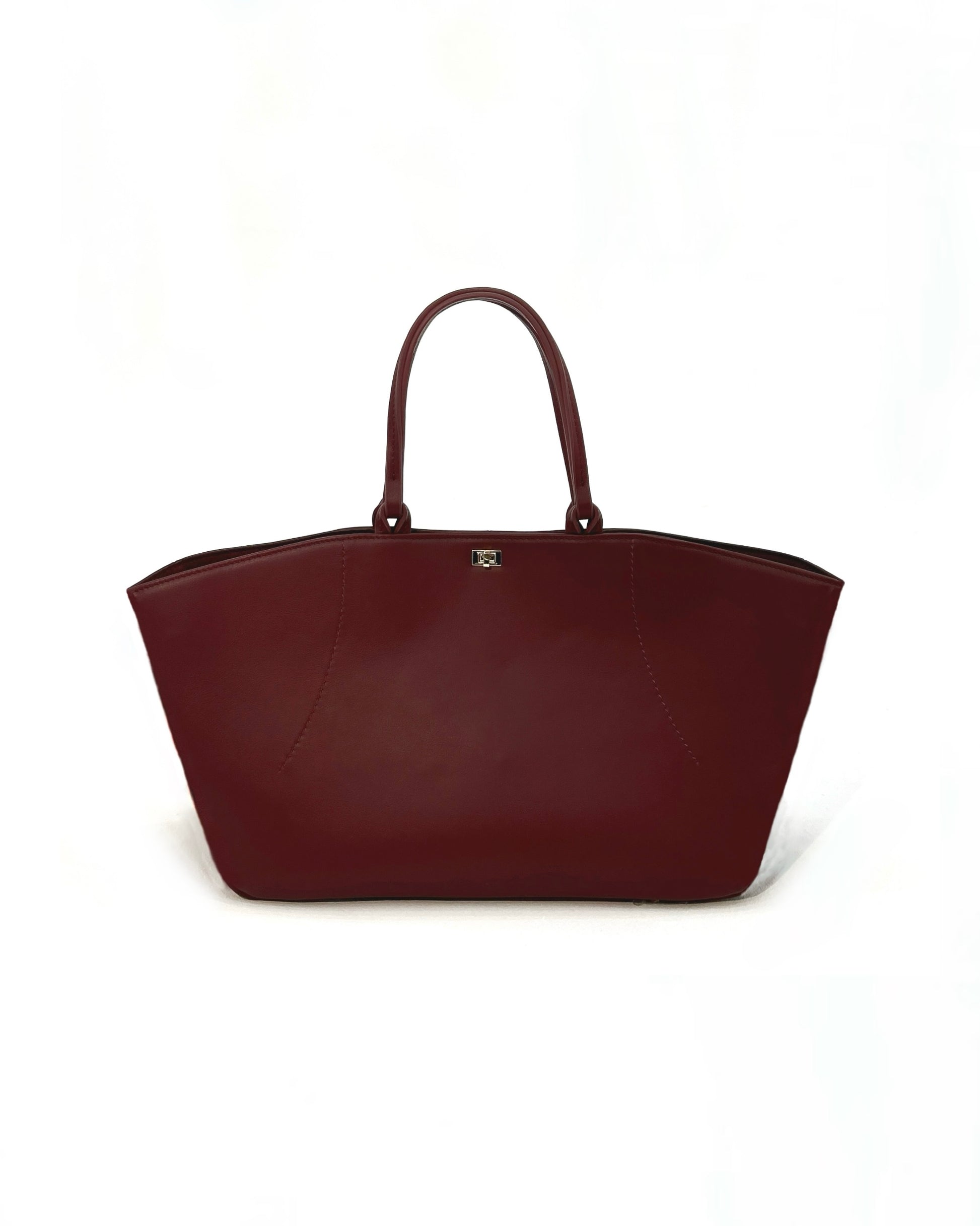 The Colette Tote bag. Made from a gorgeous dark red cowhide leather. Top handle bag with a twist lock closure. Features 3 interior zip pockets. Designed to last 