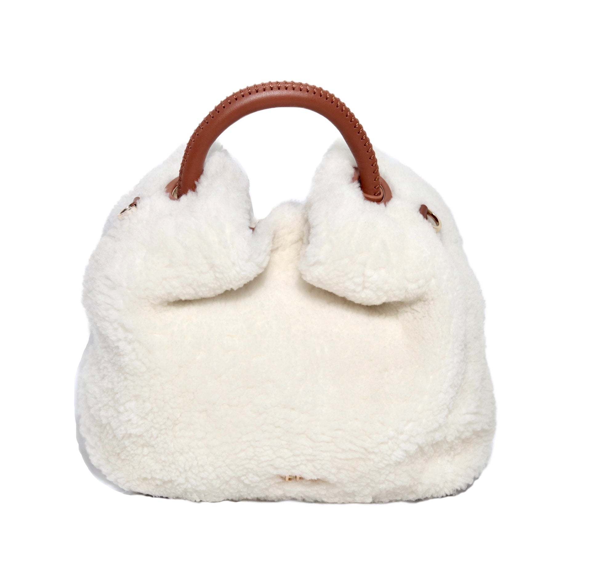 The Celia bag. Made from smooth white shearling wool and brown cowhide leather. Top handle bag. Designed to last 