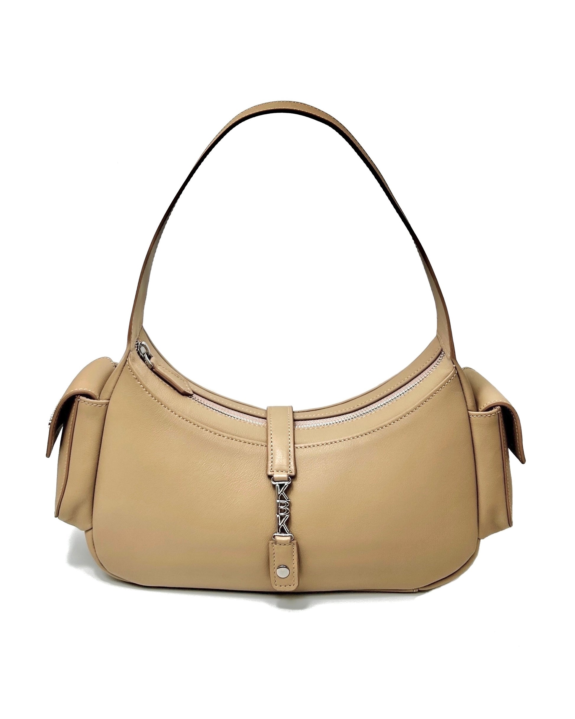 The Donna bag. Made from tan cowhide leather. Top handle bag with a special magnetic and zip closure. Features 2 side pockets on the exterior of the bag. Designed to last 